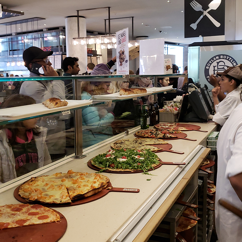 Busy Skinny Pizza Counter NYC